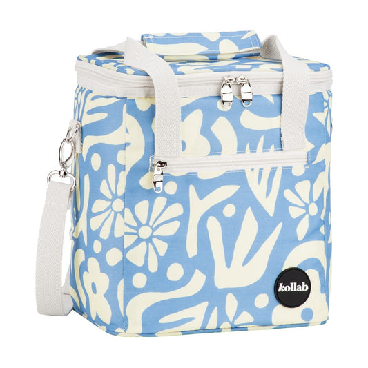 A light blue and cream floral patterned soft-sided cooler bag with dual top handles, a front zippered pocket, a detachable shoulder strap, and a black circular Kollab logo patch on the lower right.