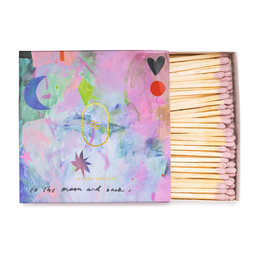 Matches with colorful packaging featuring abstract designs and text.