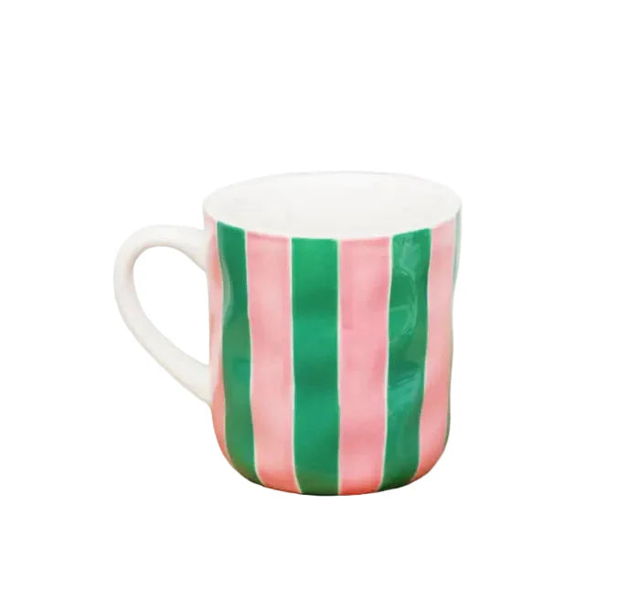 Mug with pink and green vertical stripes on a white background