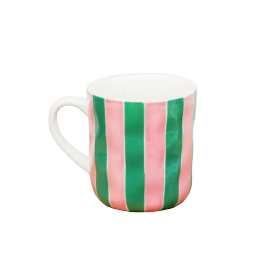 Mug with pink and green vertical stripes on a white background