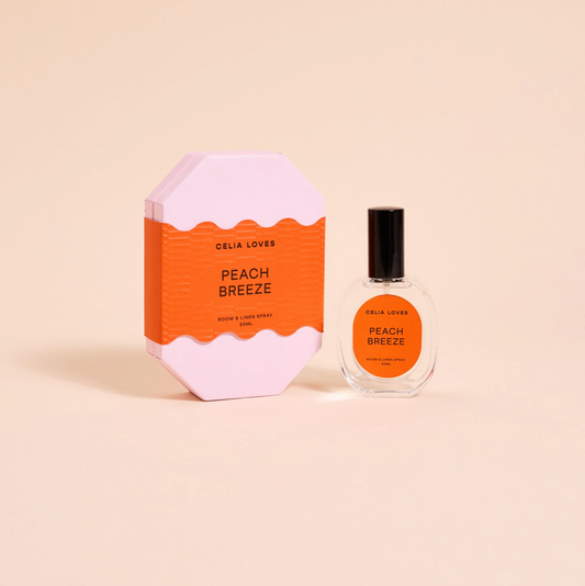 Celia Loves Peach Breeze perfume bottle and packaging on a beige background