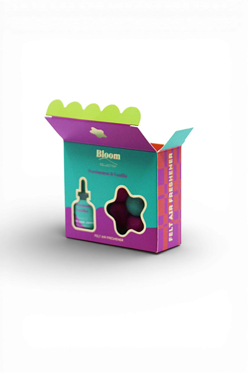 Box with open lid, scalloped edge detail, features Bloom logo in gold and 'FELT AIR FRESHENER' on side of box. 