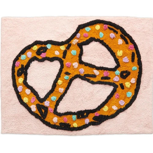 Decorative rug with a pretzel design on a pink background