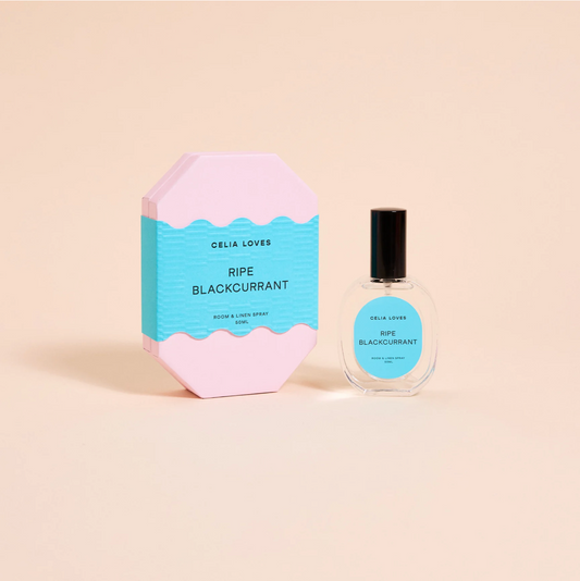 Celia Loves Ripe Blackcurrant perfume bottle and packaging on a beige background