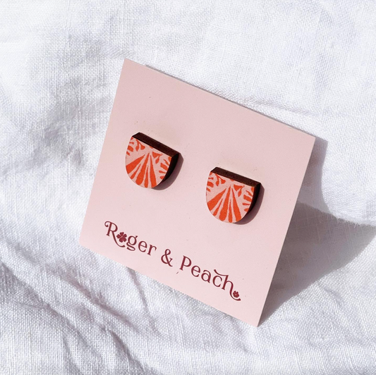 Pink and watermelon colour arch earring shape pair of earrings on a 'Roger & Peach' branded card against a white background