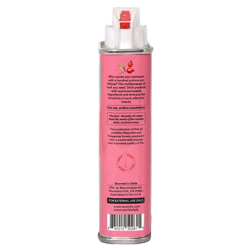 A pink spray bottle of Rosehip oil, showing the back label with text and a barcode on a white background.