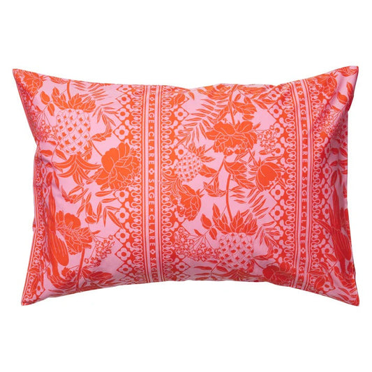 A red and orange pillowcase with a floral and geometric pattern