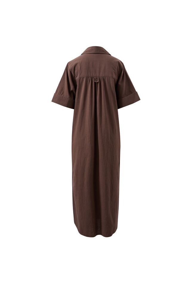 A dark brown short-sleeve shirt dress shown from the back, featuring a buttoned waist and a relaxed, straight silhouette, displayed on a clean white background.