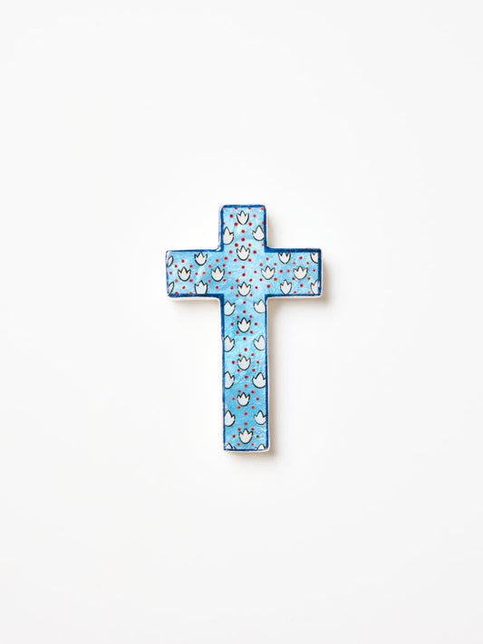 Decorative cross with blue and white pattern on a white background