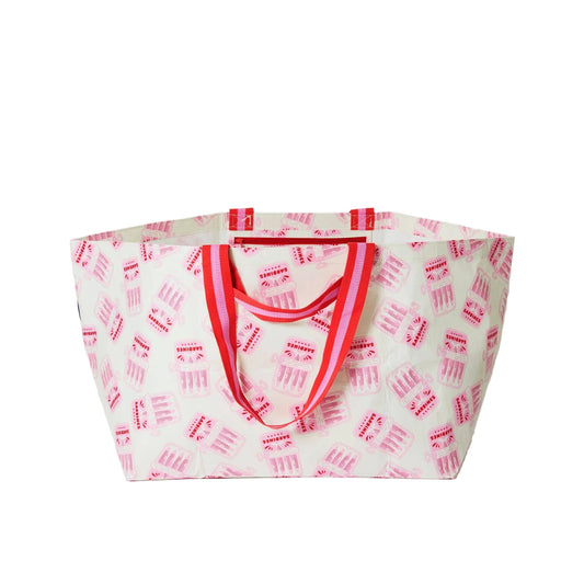 Tote bag with red handles and pink text pattern on a white background