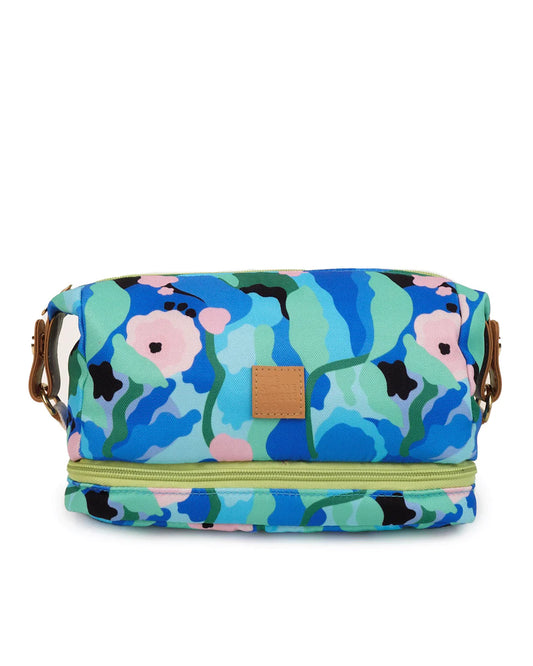 A multicolored floral cosmetic bag with a zipper closure and a leather-like strap.