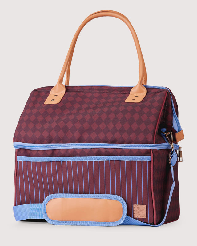 Multicolored bag with geometric patterns on a light gray background