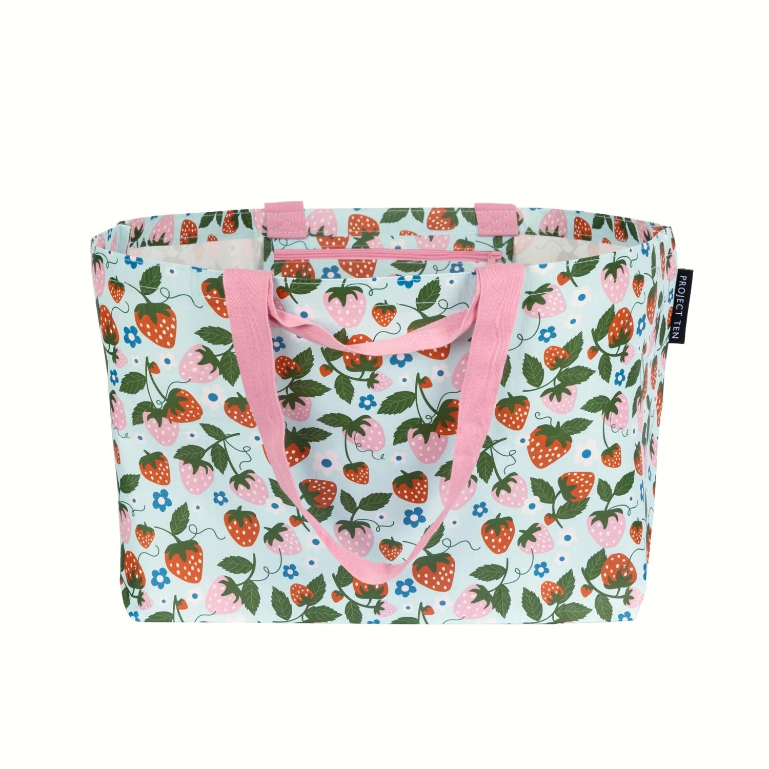 Tote bag with strawberry pattern and pink handles on a white background