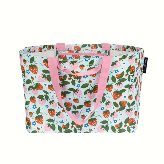 Tote bag with strawberry pattern and pink handles on a white background