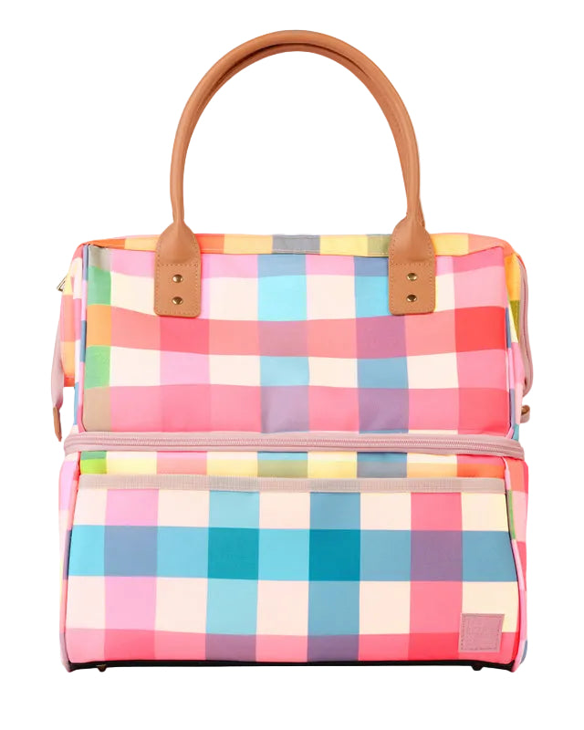 Colorful checkered handbag with brown handles on a light gray background