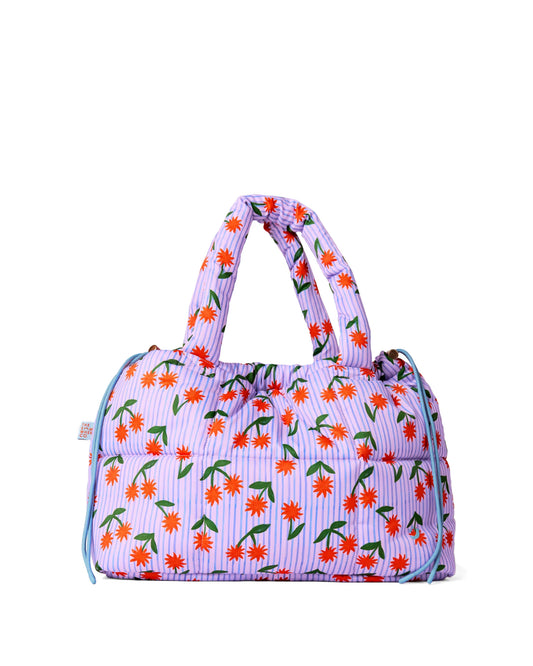 Floral patterned handbag on a white background