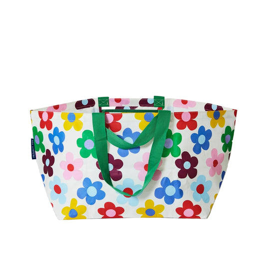 Colorful floral-patterned tote bag with green handles on a white background