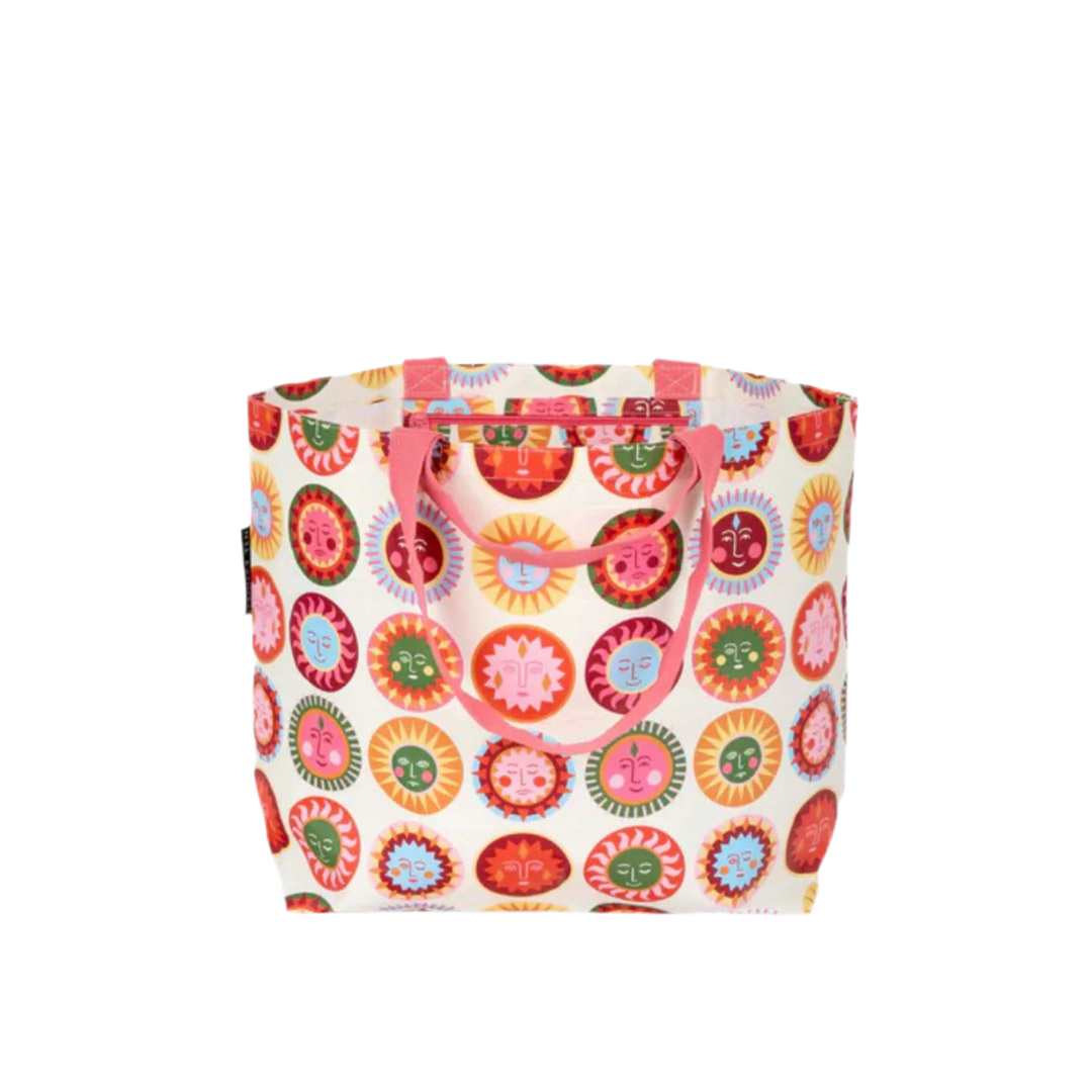 Colorful sun face pattern tote bag with pink handles on a white background