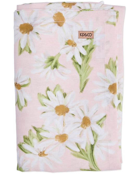 Floral blanket with daisies on a pink background, featuring the Kid&Coé brand.