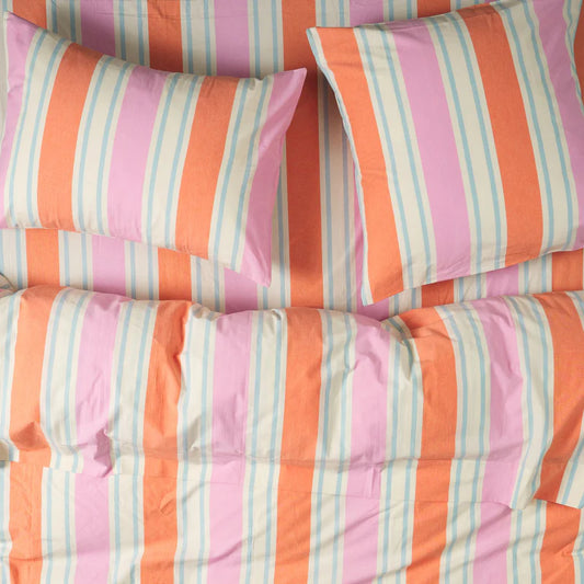 A set of striped cotton euro pillowcases in colors pink, orange, and white.