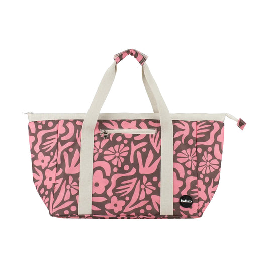 Tote bag with pink and brown pattern sits on white background.