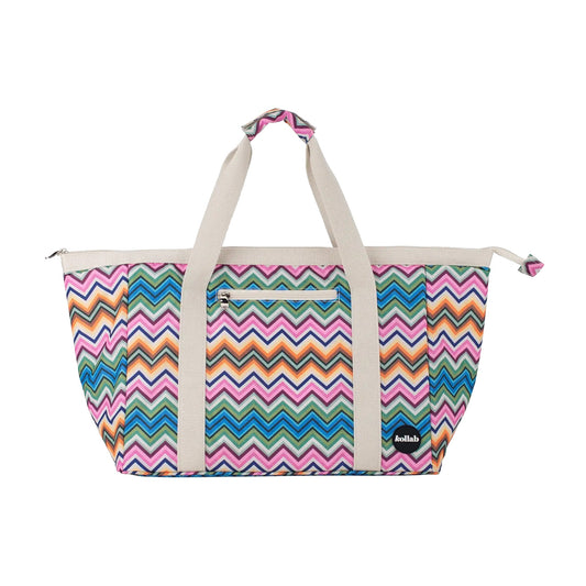 Tote bag with multicolour zig zag print on white background.
