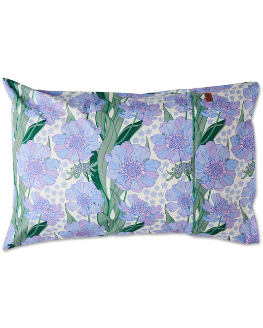 A pillowcase with a pattern of purple and blue flowers on a white background.