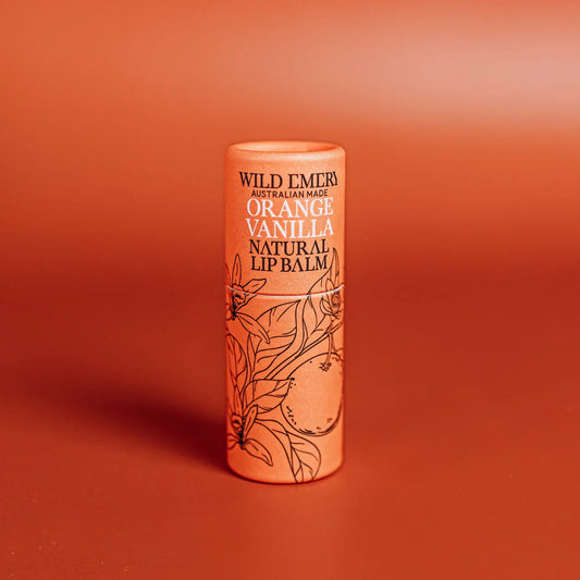 Lip balm container with 'Wild Emery' branding on an orange background. Orange and Vanilla Flavour. 