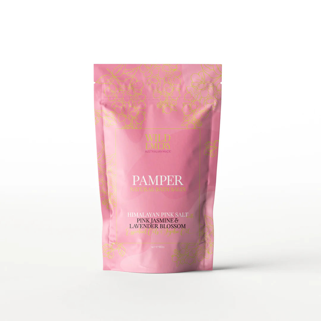 Pink packaging of Wild Emery Pamper bath salt with floral design on a white background. Himalayan Pink Salt. Scent Pink Jasmine and Lavender Blossom.