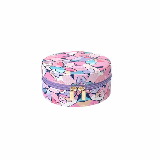 Round floral-patterned jewelry box with a purple zipper on a white background