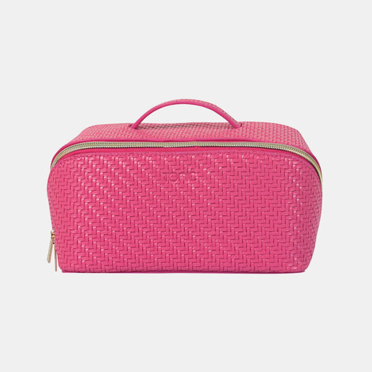 Pink woven travel case on a light gray background