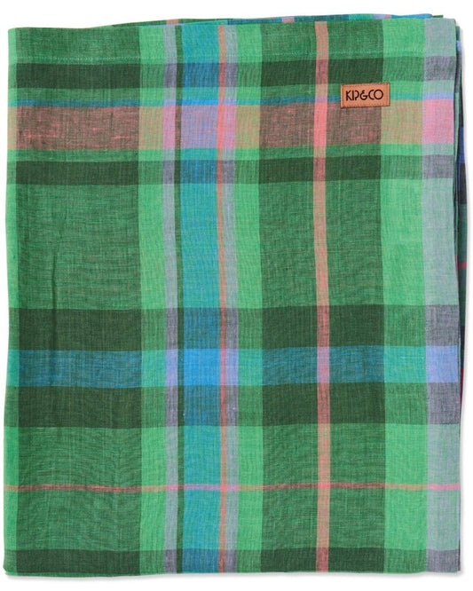 A rectangular linen tablecloth featuring a tartan pattern with green, blue, pink, and purple stripes.